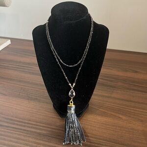 Faceted bead single strand necklace with clear crystal and tassel